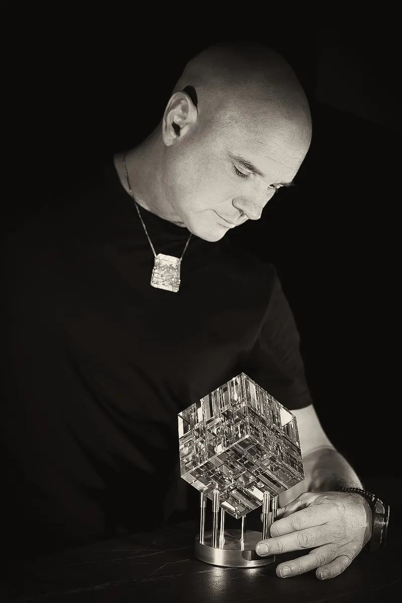 Jack Storms with one of his optic glass sculptures