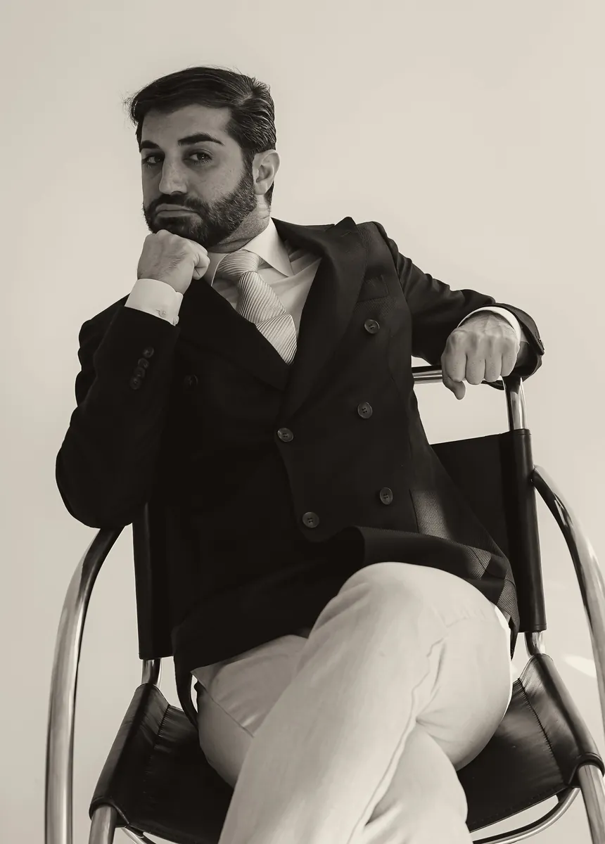 Mr. Andy Alem, President of the Diamond Award Club, seated in a dark jacket